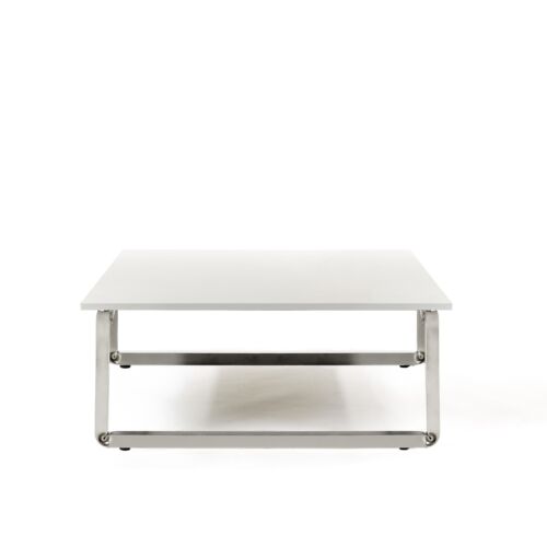 low table made in chrome steel and wooden desk